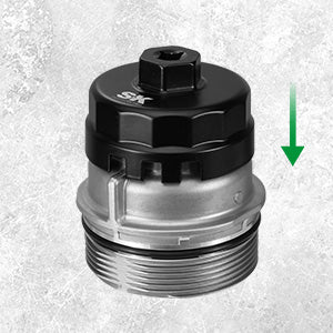 Mechanical component with a black top and silver bottom on a textured gray background